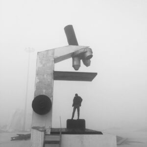 A giant microscope sculpture in a foggy outdoor setting of Kapurthala, India.