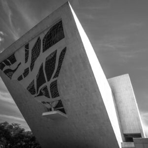 Stunning modern architecture featuring geometric windows under a bright sky.